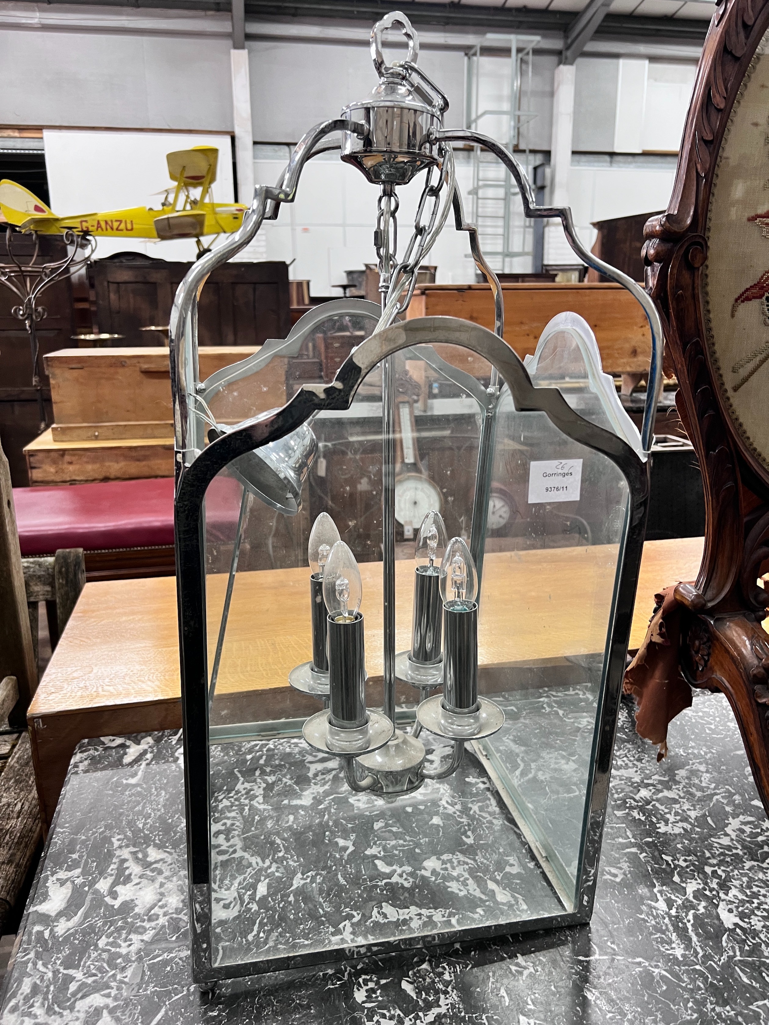 A chromed metal hall lantern, width 35cm, height 75cm *Please note the sale commences at 9am.